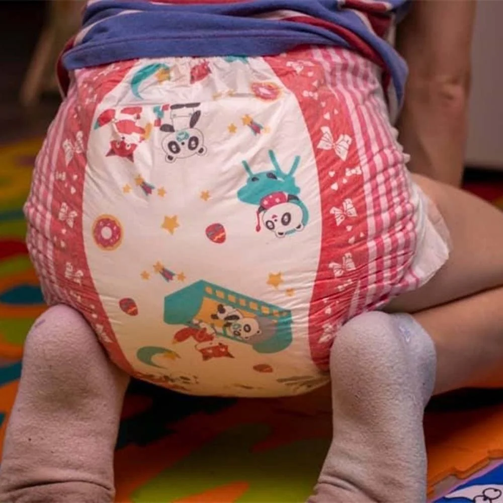 adult baby girl posing in diapers and pampers